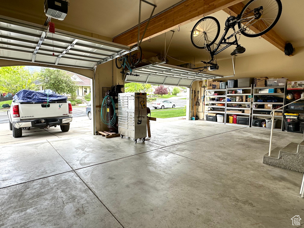 Garage featuring a garage door opener
