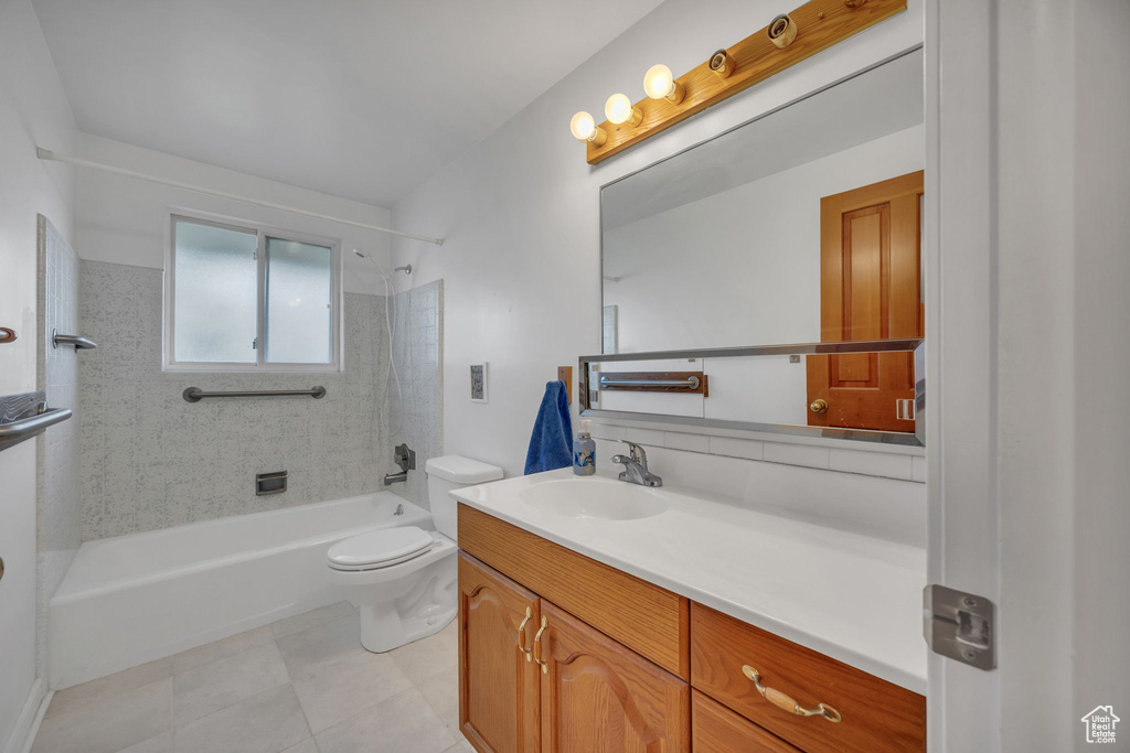 Full bathroom featuring  shower combination, vanity, and tile patterned floors