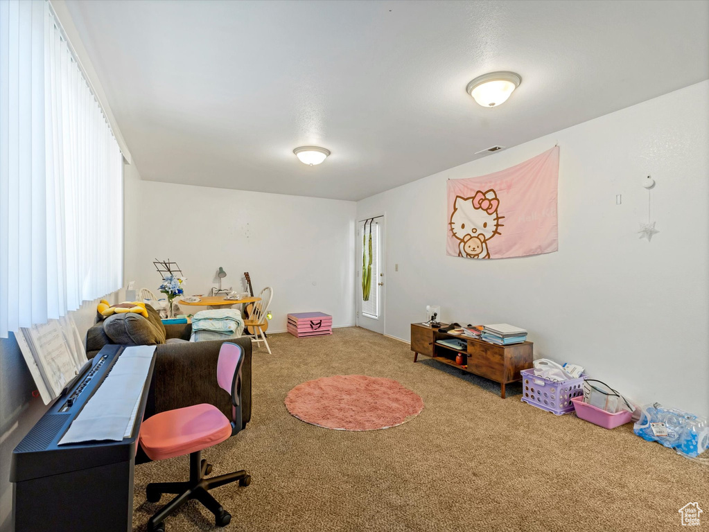 Game room featuring carpet and a desk