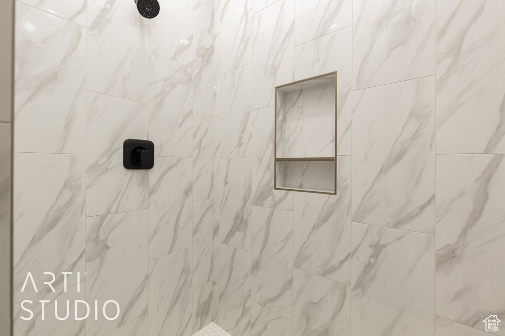 Bathroom view of a tile shower