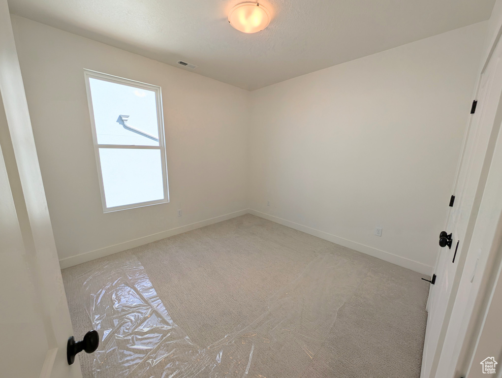 Unfurnished room with plenty of natural light