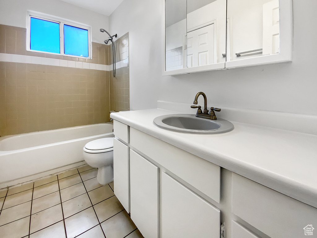 Full bathroom featuring vanity, bathtub / shower combination, and tile patterned floors