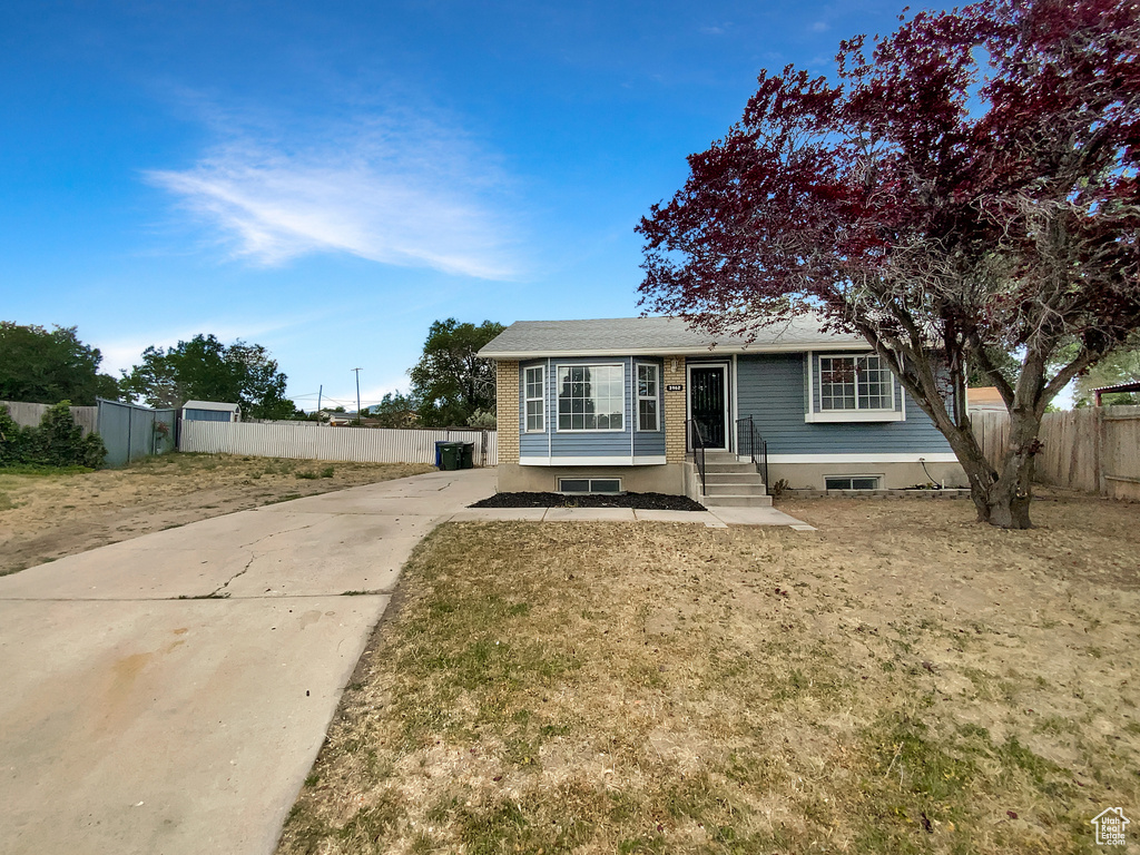 View of front of property with concrete driveway