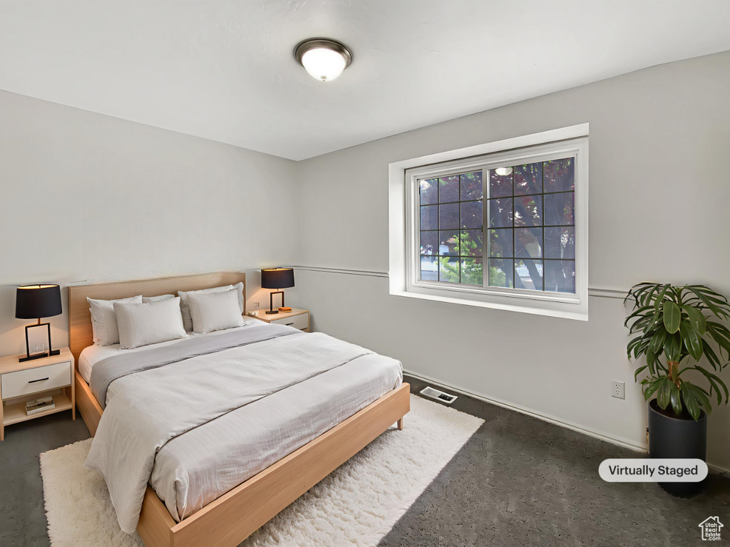 Carpeted bedroom with baseboards