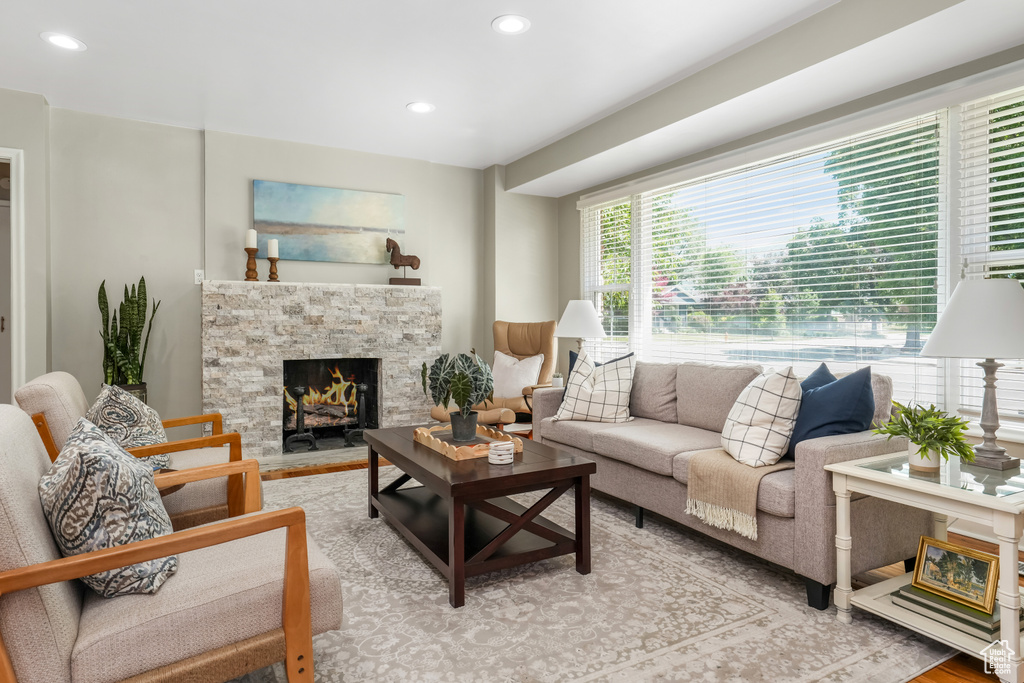 Living area featuring a fireplace, recessed lighting, and light wood finished floors