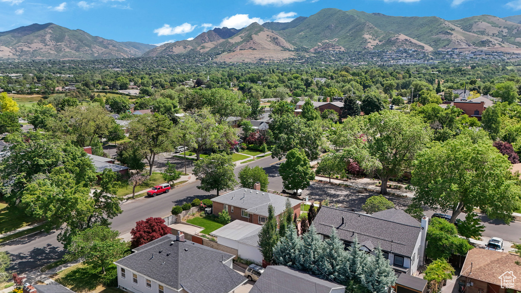 Aerial view of residential area featuring a mountainous background