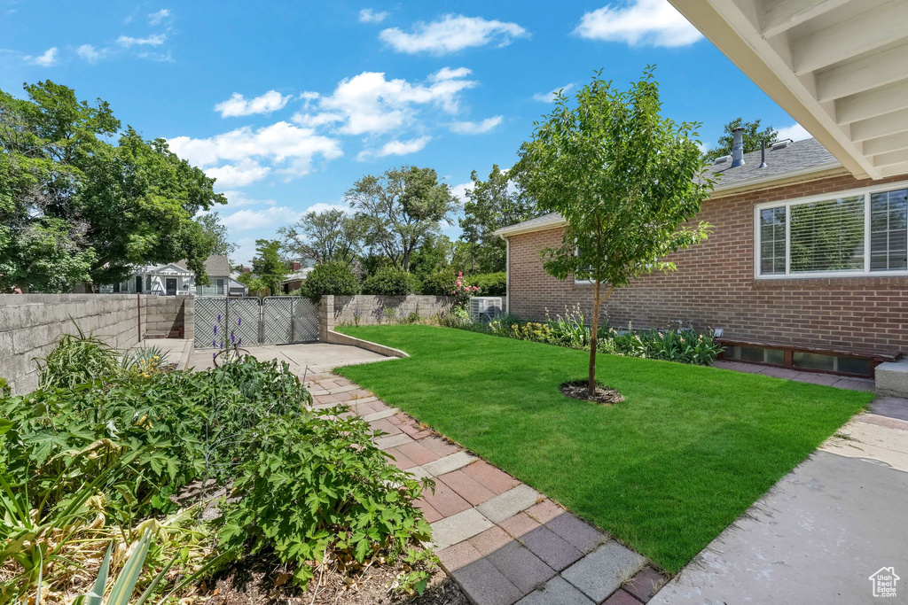 View of yard with a patio