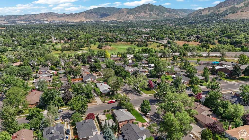 Aerial perspective of suburban area featuring a mountain backdrop