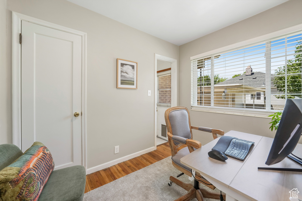 Office area with wood finished floors and baseboards