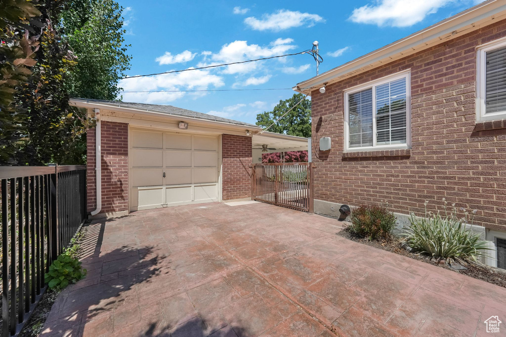 Garage featuring concrete driveway
