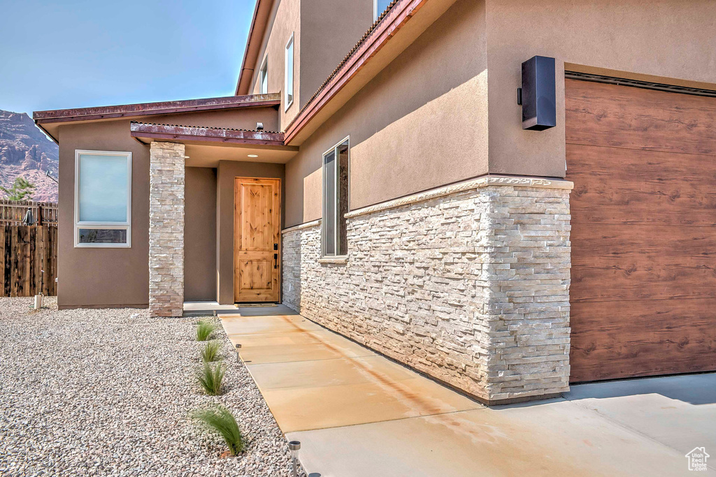 Property entrance featuring stucco siding