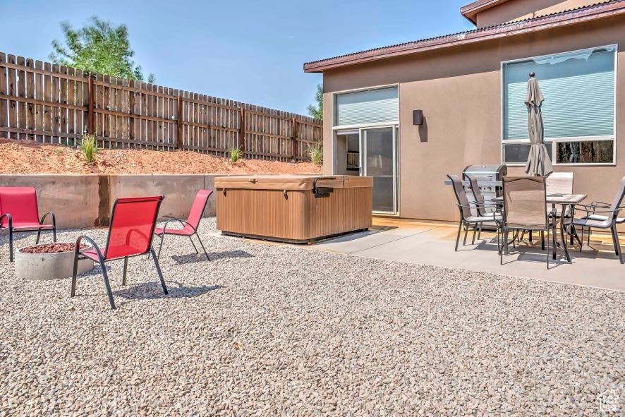 View of patio / terrace featuring a hot tub