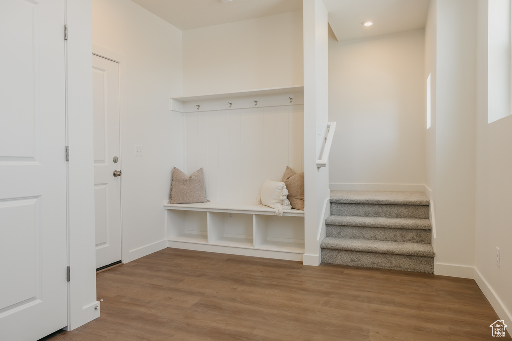 Mudroom with wood finished floors and recessed lighting