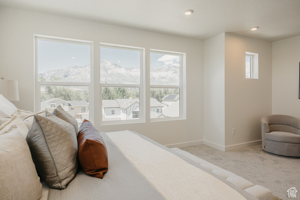 Bedroom featuring carpet, a mountain view, and recessed lighting