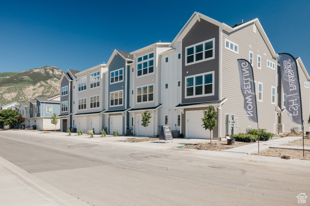 View of front of property featuring a mountain view and a residential view