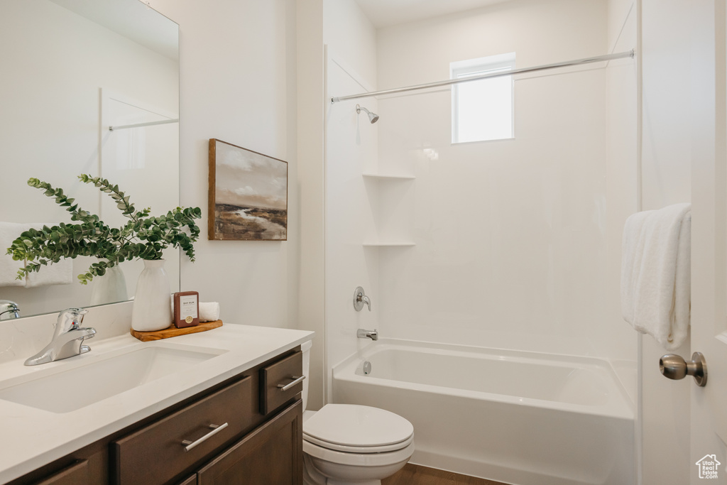 Bathroom with vanity and shower / tub combination