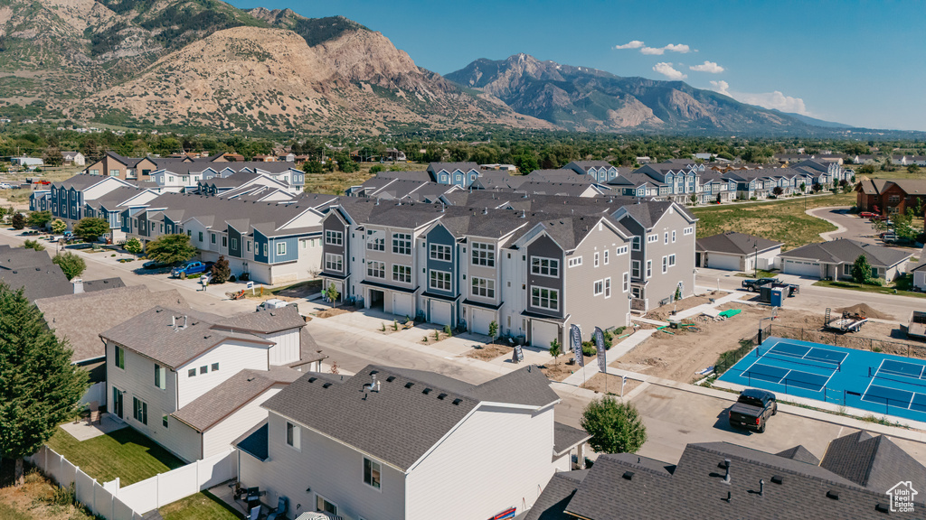 Aerial perspective of suburban area featuring a mountain backdrop
