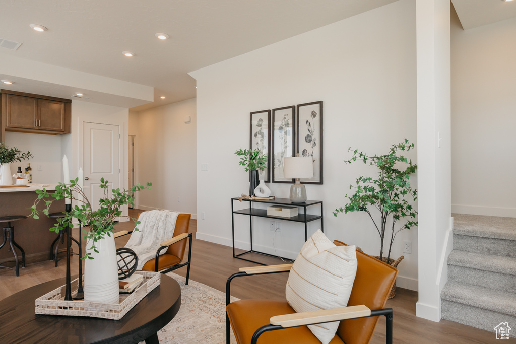 Dining area featuring wood finished floors, recessed lighting, and stairway
