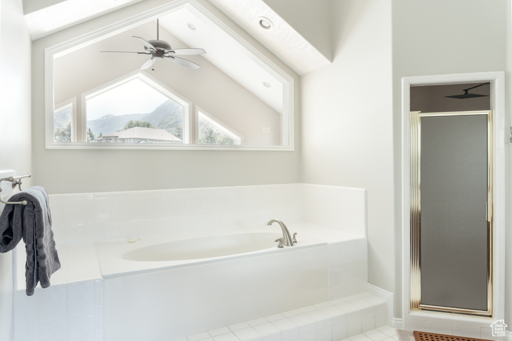 Bathroom with a stall shower, a garden tub, ceiling fan, and tile patterned flooring