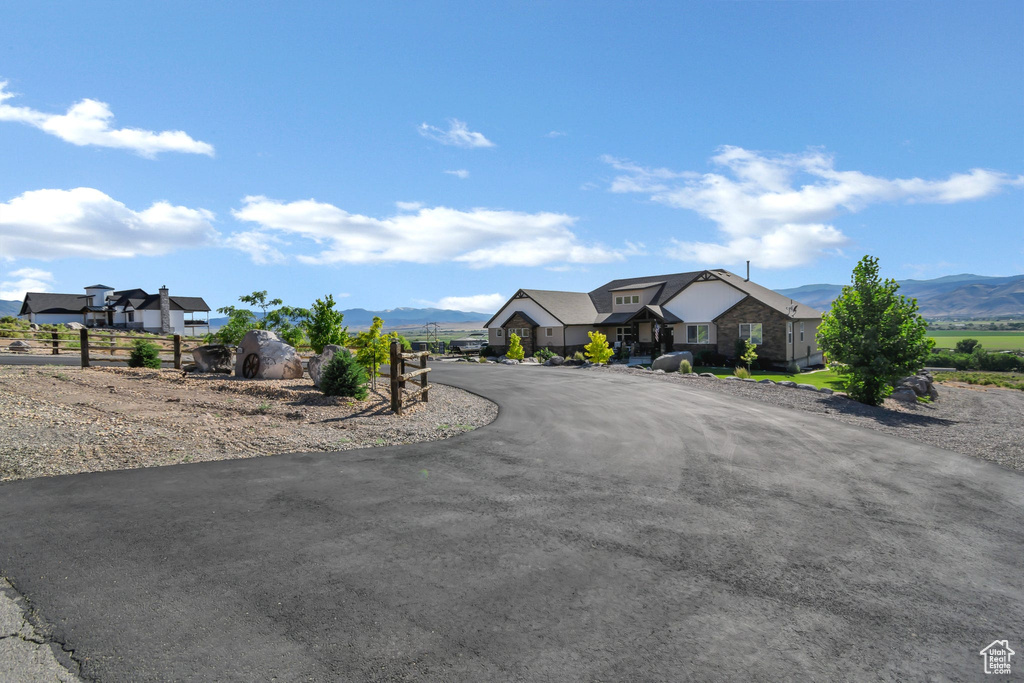 View of asphalt driveway featuring a mountain view