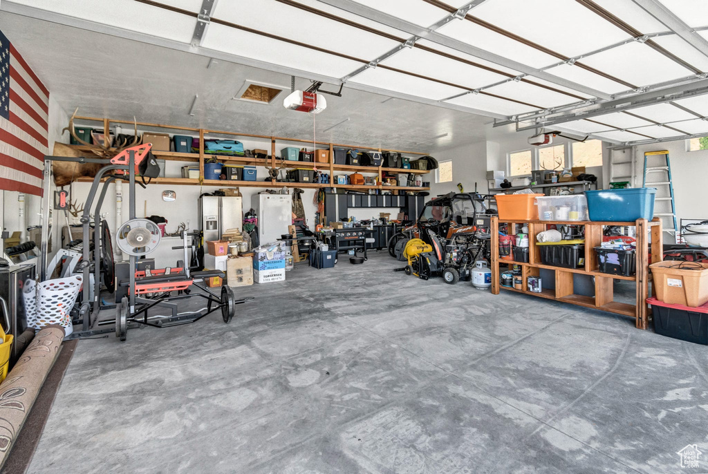 Garage featuring a garage door opener