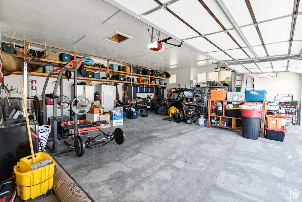 Garage featuring a garage door opener