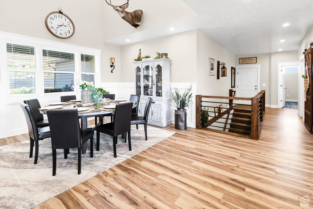 Dining area featuring light wood-type flooring and recessed lighting