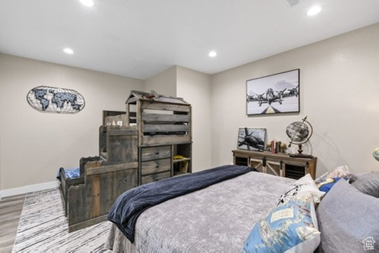 Bedroom featuring wood finished floors and recessed lighting