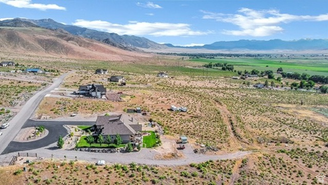 Aerial view of sparsely populated area featuring a mountain backdrop