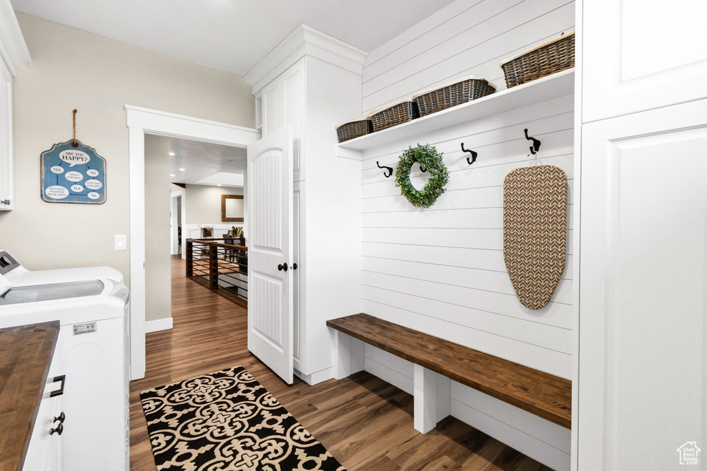 Mudroom featuring independent washer and dryer and wood finished floors