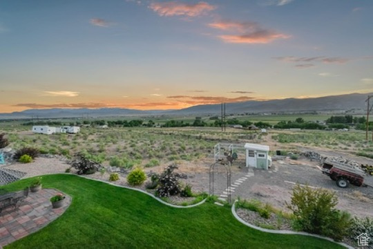 View of grassy yard featuring a mountain view