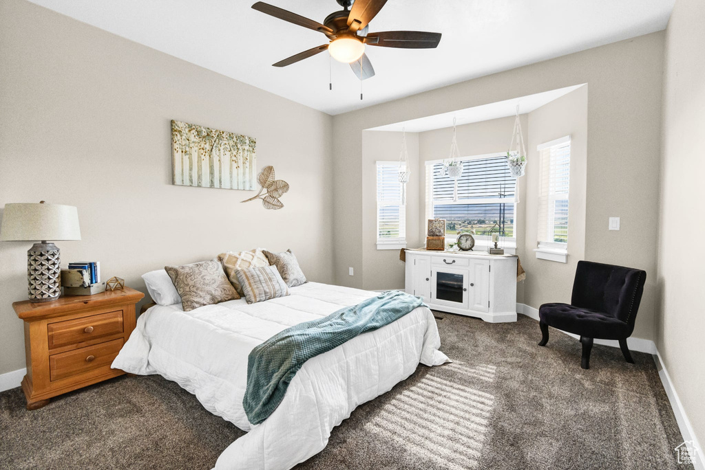 Bedroom featuring carpet floors and a ceiling fan