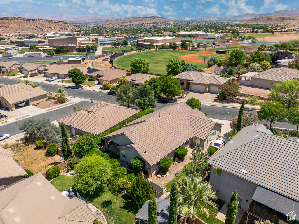 Aerial view of residential area featuring a mountainous background