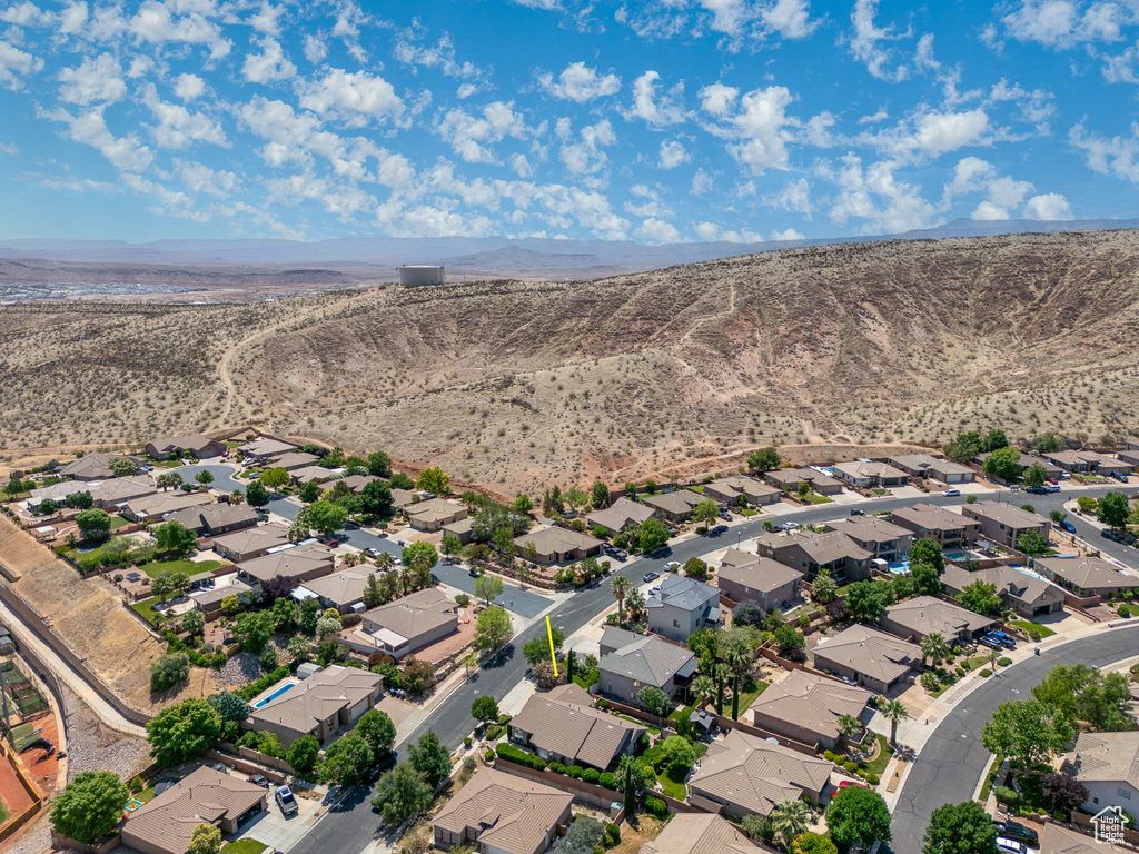 Aerial perspective of suburban area with a mountainous background