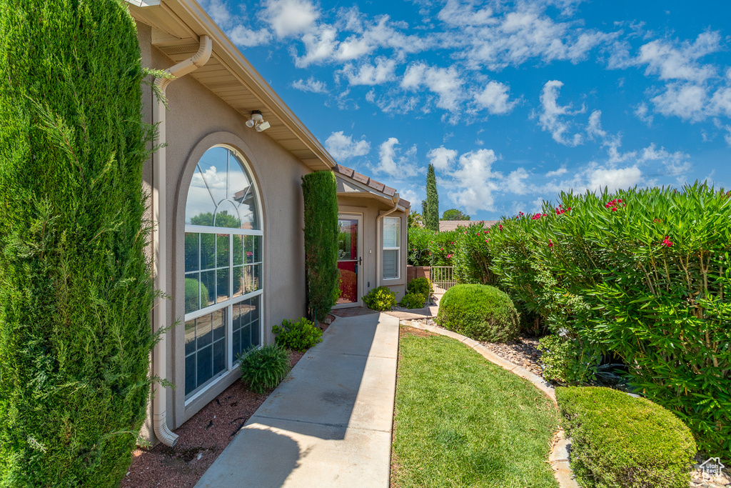 Property entrance featuring stucco siding