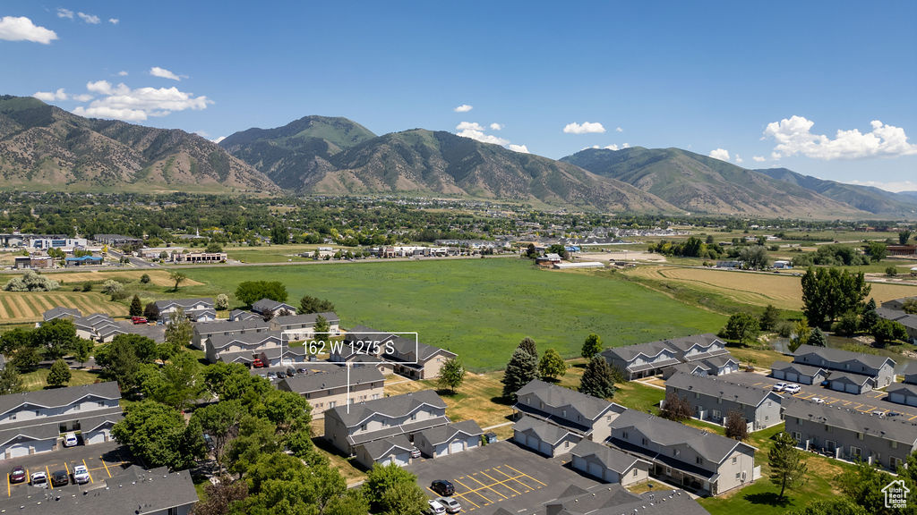 View of mountain background featuring nearby suburban area