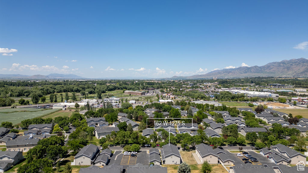 Aerial view of residential area featuring mountains