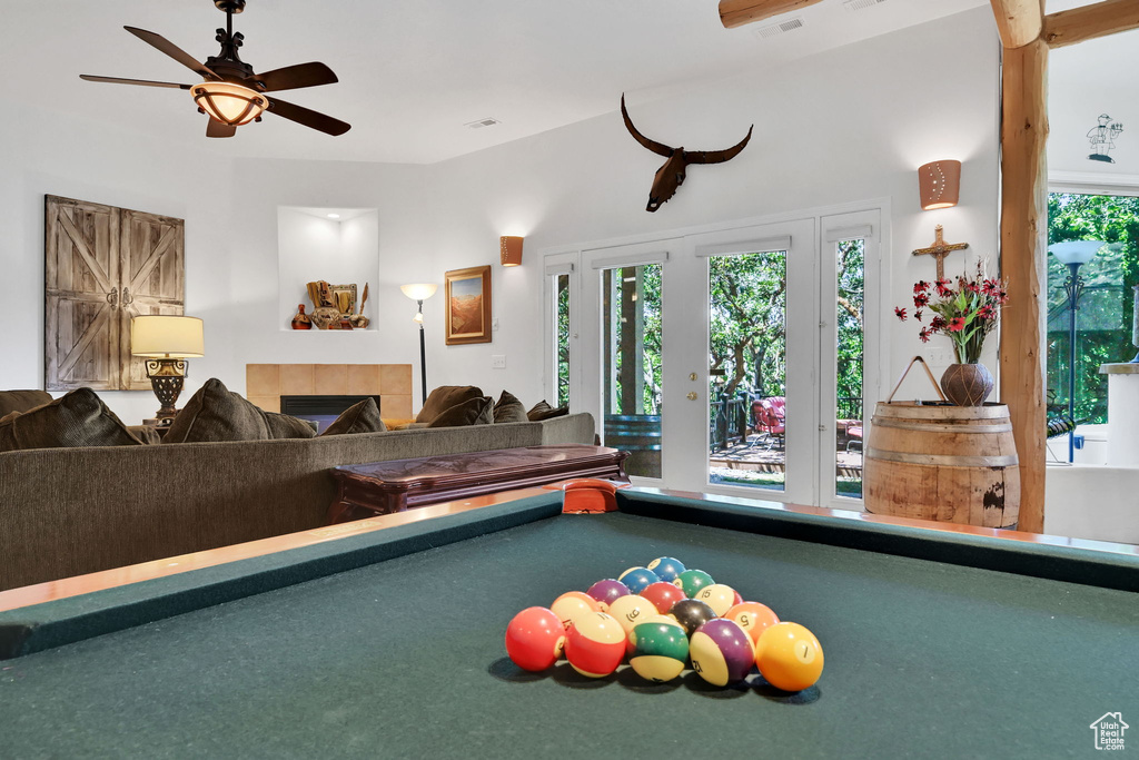 Rec room with ceiling fan and billiards table