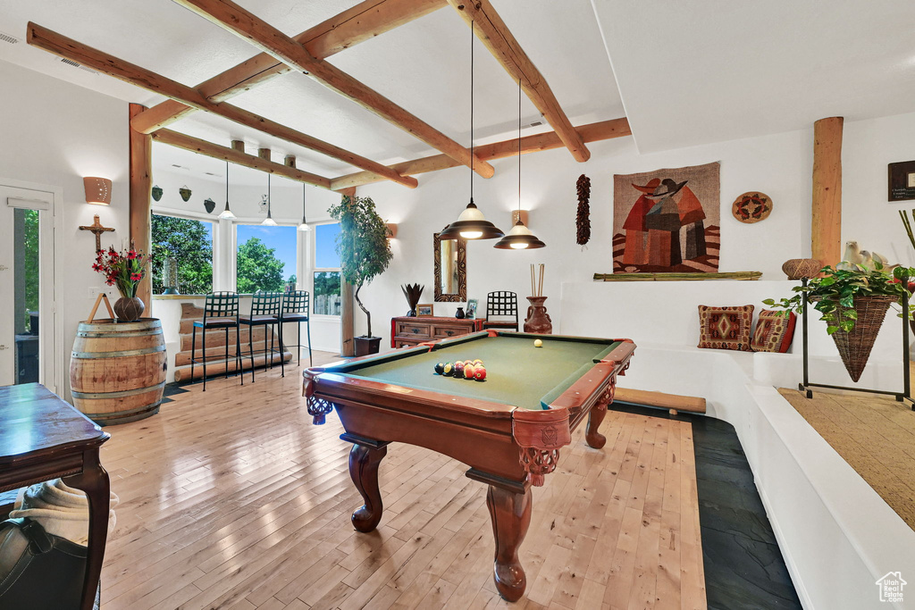 Rec room with beam ceiling, hardwood / wood-style flooring, and billiards