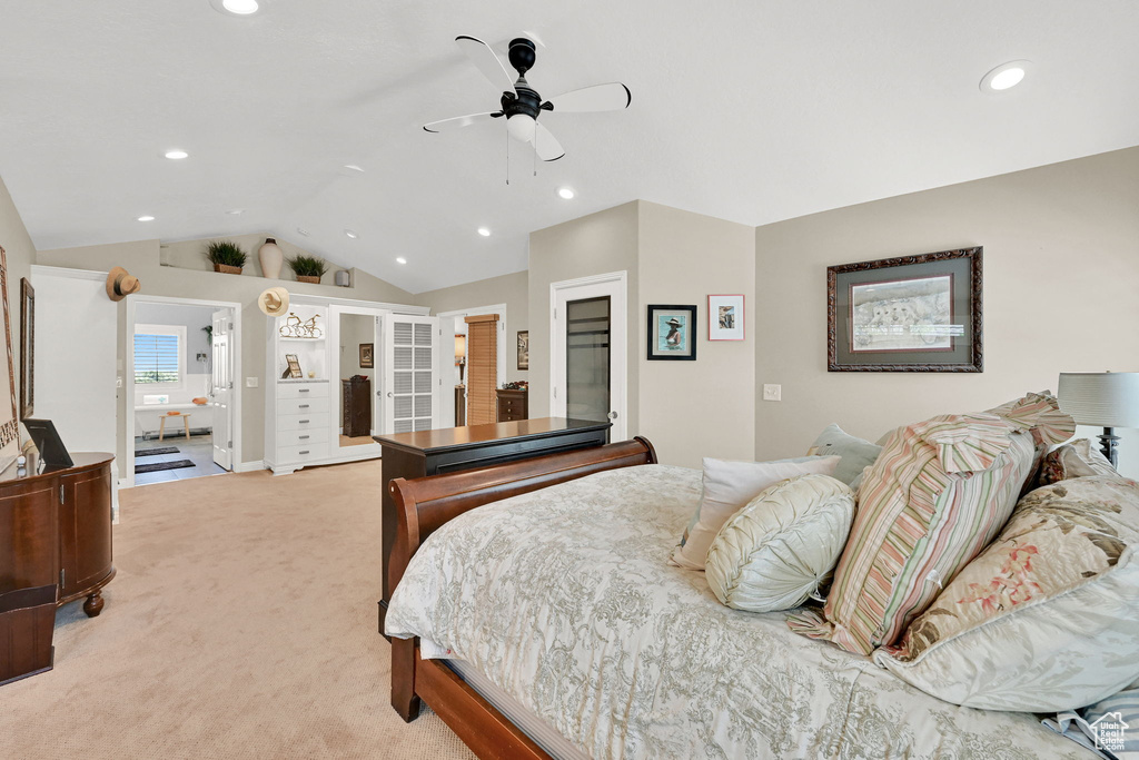 Bedroom with lofted ceiling, recessed lighting, light carpet, and a ceiling fan