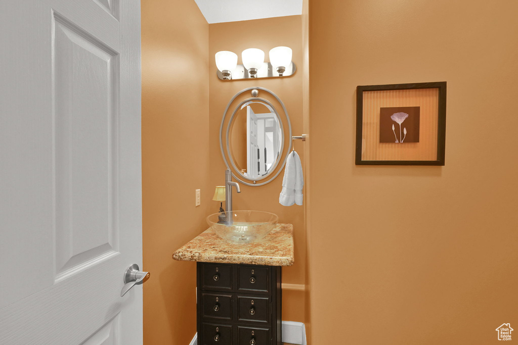 Bathroom featuring vanity and baseboards
