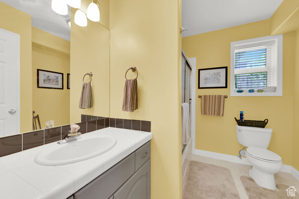 Bathroom featuring vanity and tile patterned floors