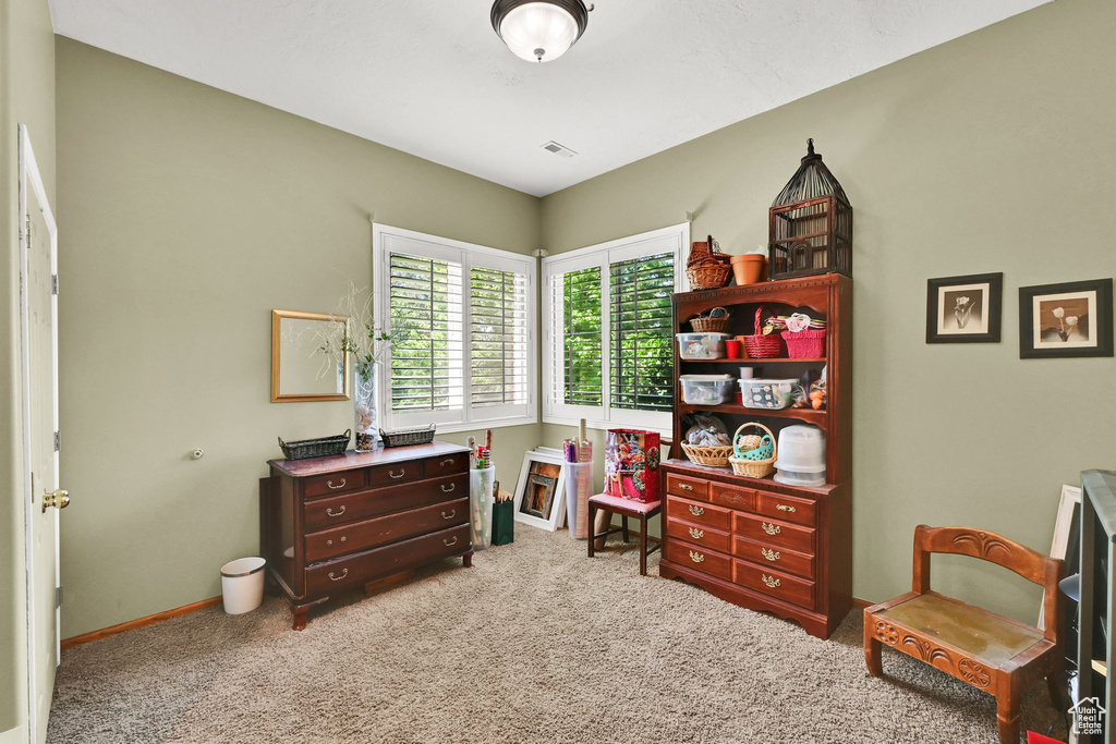 Carpeted bedroom with baseboards