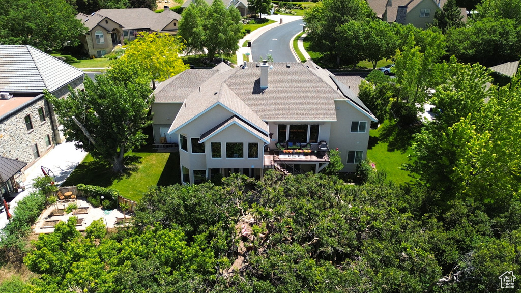 Aerial view of residential area with a tree filled landscape