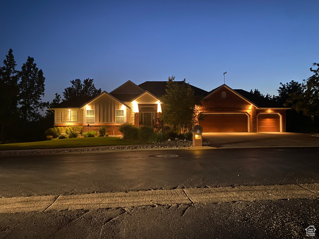 View of front of house featuring a garage, board and batten siding, and concrete driveway