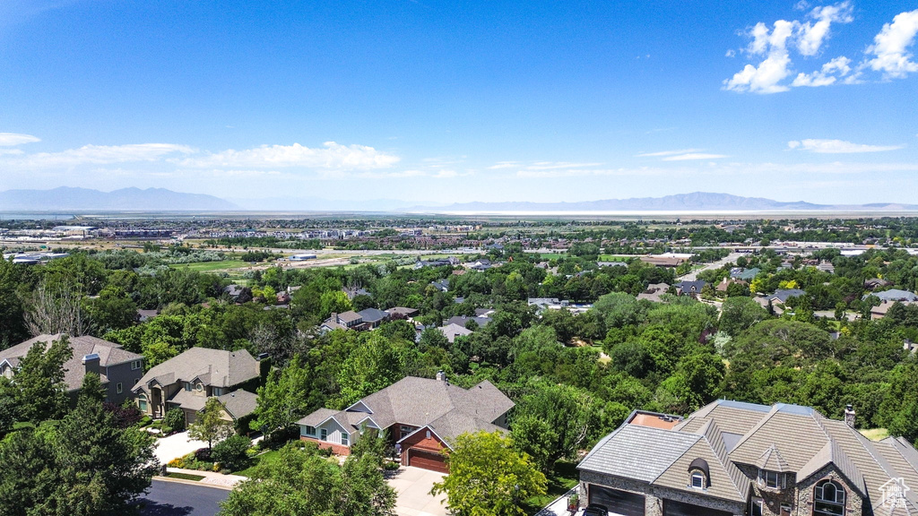Aerial view of residential area featuring mountains