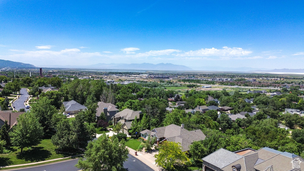 Aerial perspective of suburban area featuring a mountain backdrop