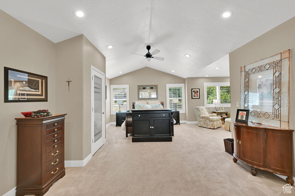 Playroom featuring ceiling fan, light colored carpet, vaulted ceiling, recessed lighting, and plenty of natural light