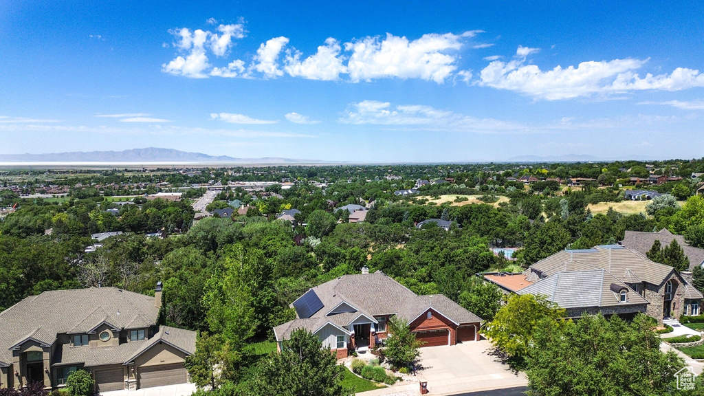 Aerial perspective of suburban area featuring a mountain backdrop