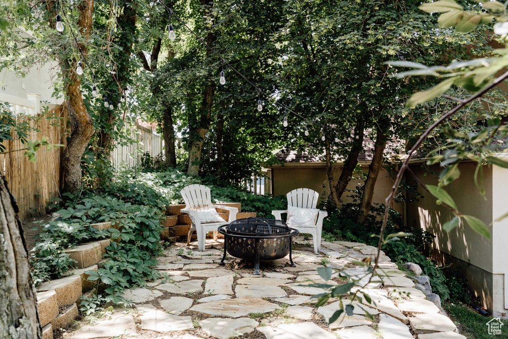 View of patio featuring an outdoor fire pit